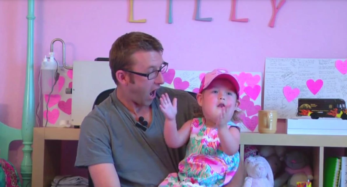 Lilly and her dad playing together at home